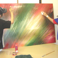 Teanagers painting an abstract
